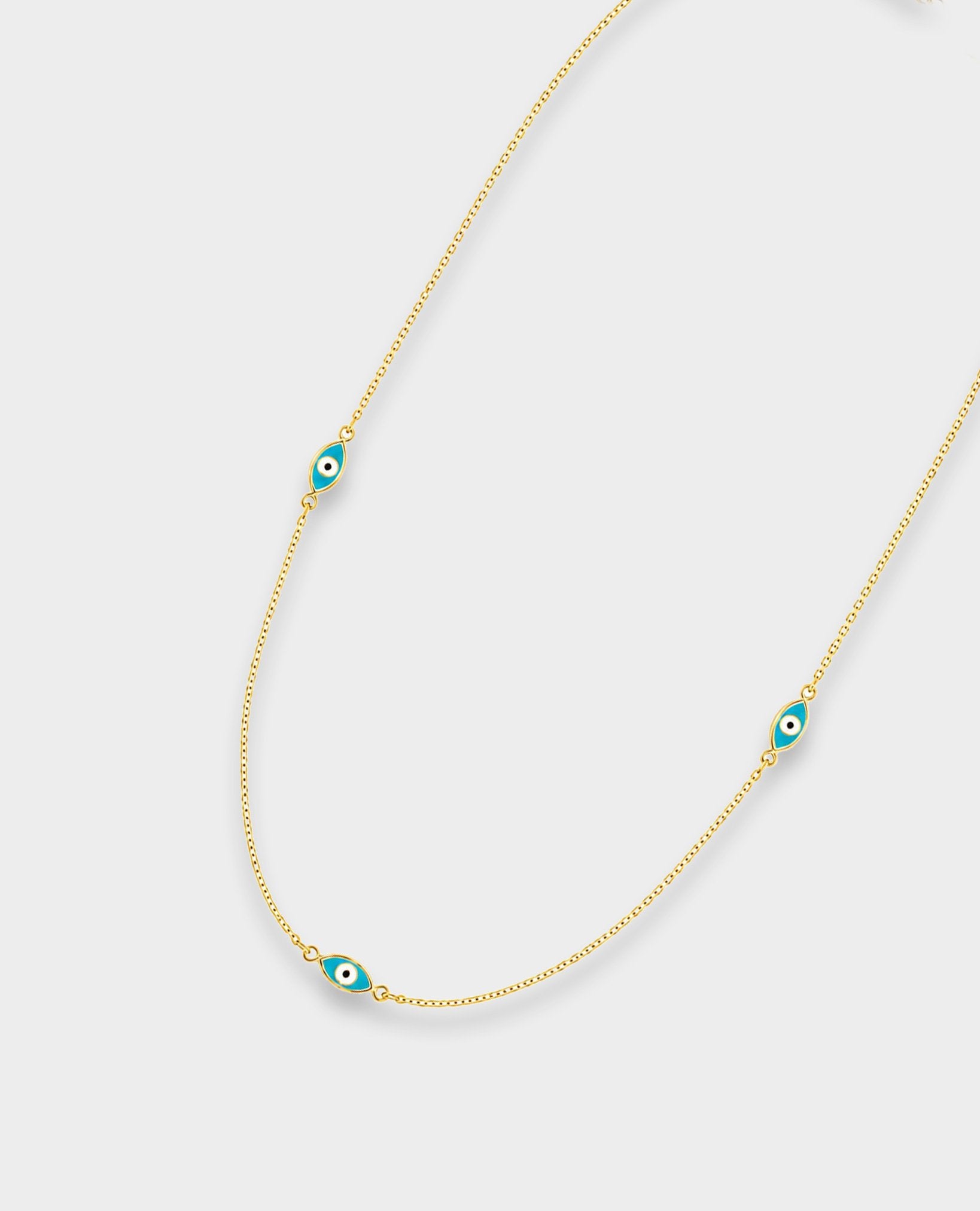 DOUBLE-SIDED GOLD EVIL EYE NECKLACE